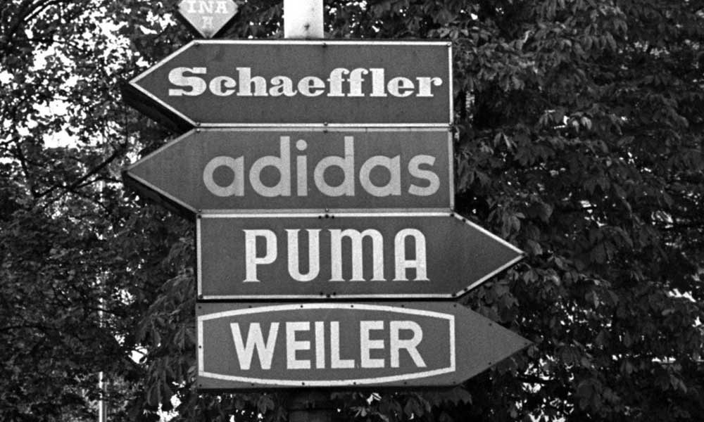 adidas puma history