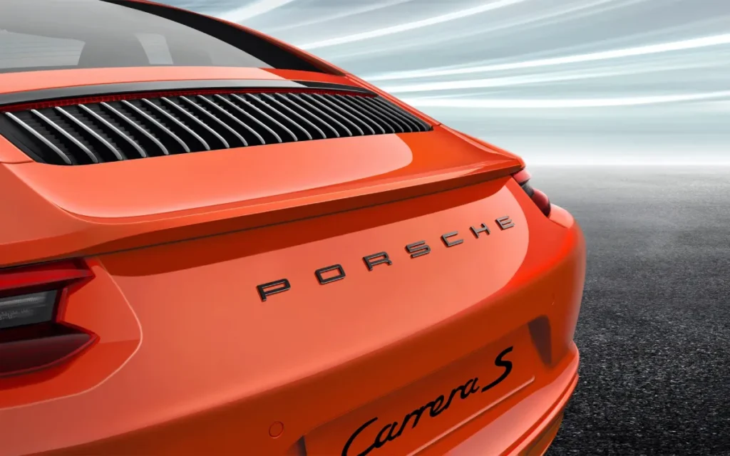 Orange Porsche Cayman S Rear With Porsche Lettering And Cayman S Script, Slatted Rear Grille.